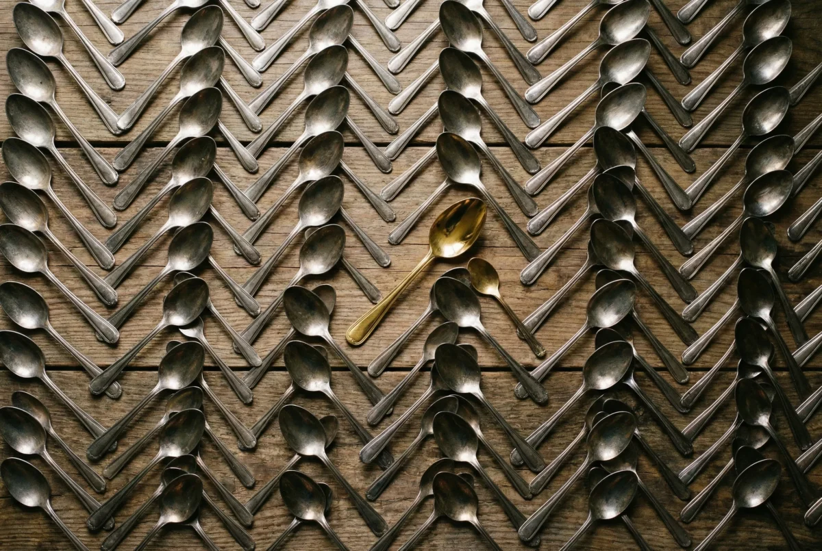 Row of chairs with one red chair illustrating odd one out in photo composition