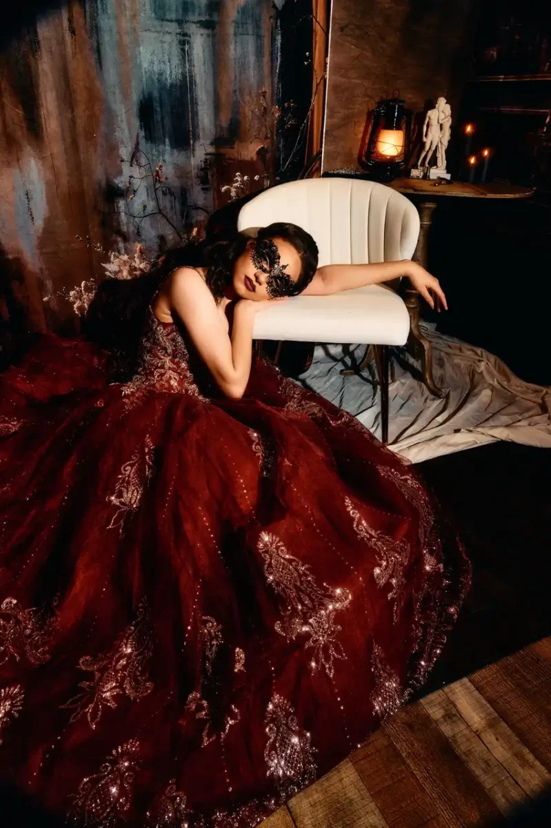 Cinematic portrait Photography by Crystal Monique of a woman in a burgundy gown