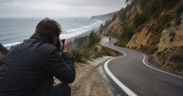 Photographer composing a winding road and small subject to create dynamic tension