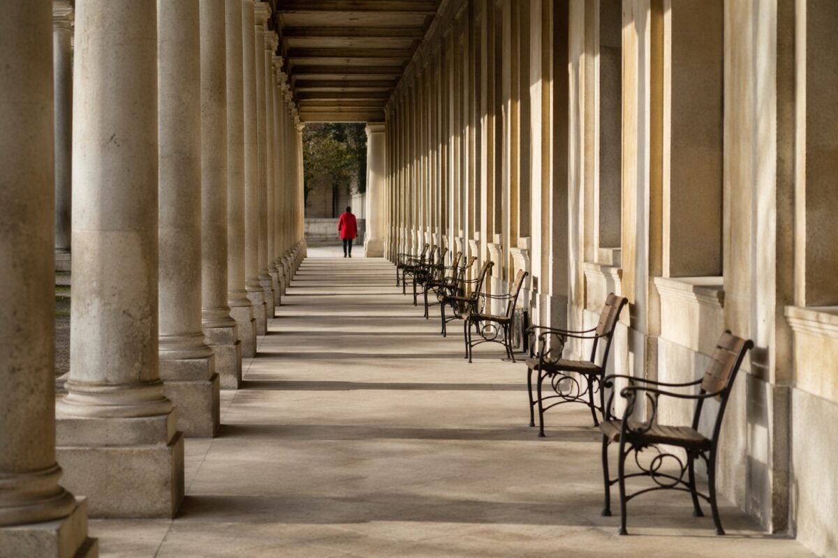 Repeating trees or architectural shapes creating rhythm in a composition