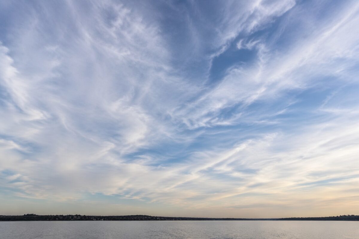 low horizon line dramatic sky Low horizon landscape composition emphasizing dramatic sky and open atmosphere
