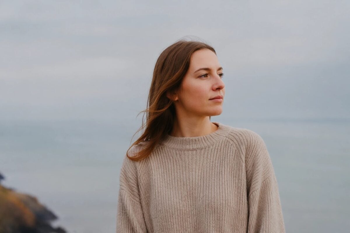 Portrait showing how a small bright background distraction can weaken negative space