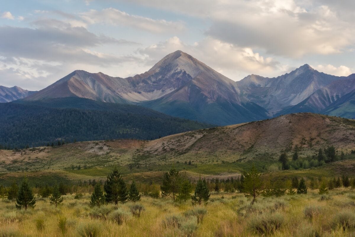 Natural mountain rocks and trees creating triangle shapes in a landscape