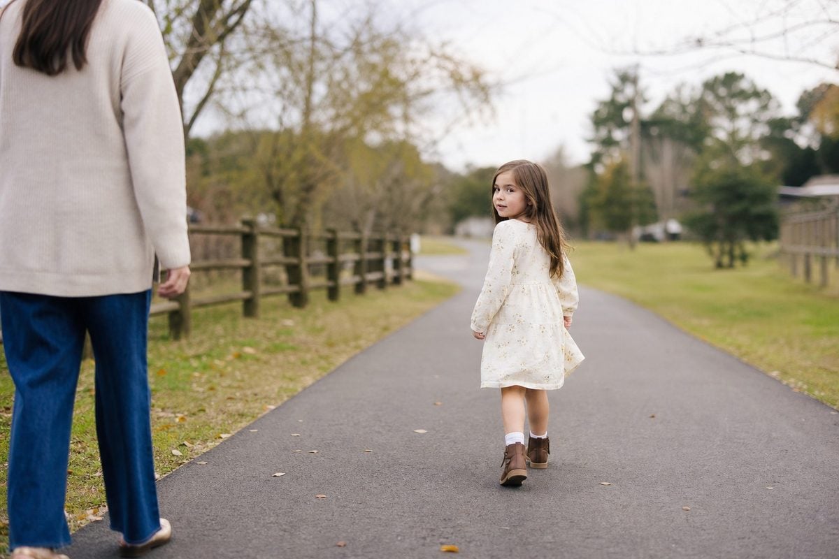 child movement pose walk back Child photography movement prompt with a child walking and looking back naturally