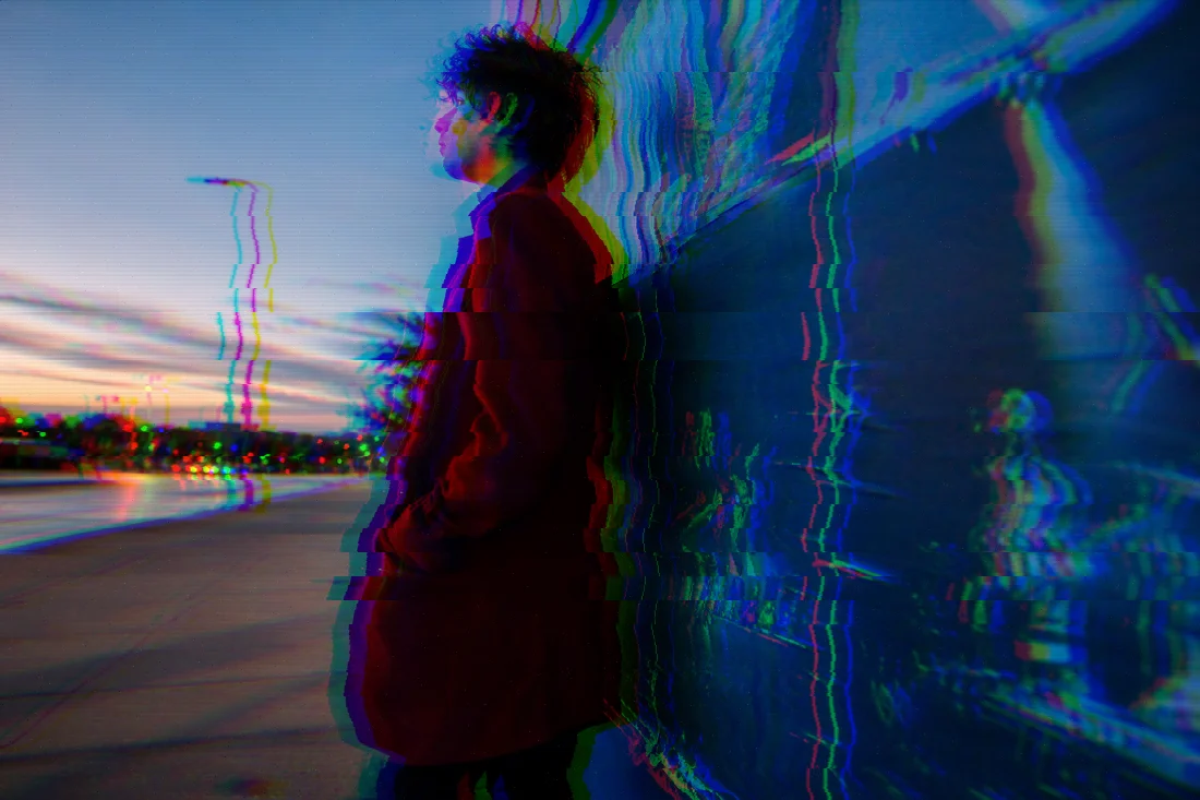 evoto glitch bold split source Profile portrait in a red coat against a blue wall, prepared for a bold RGB split photo effect