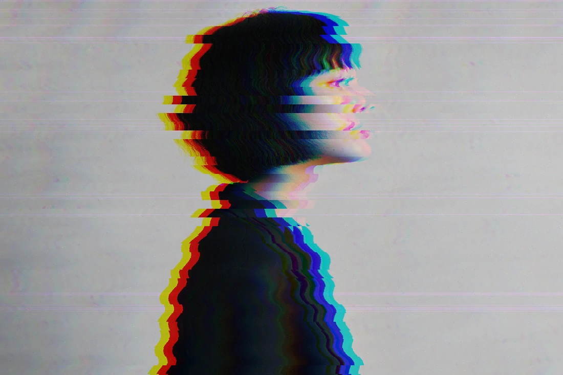 Side-profile portrait with full-image random tearing created by Jitter in Evoto