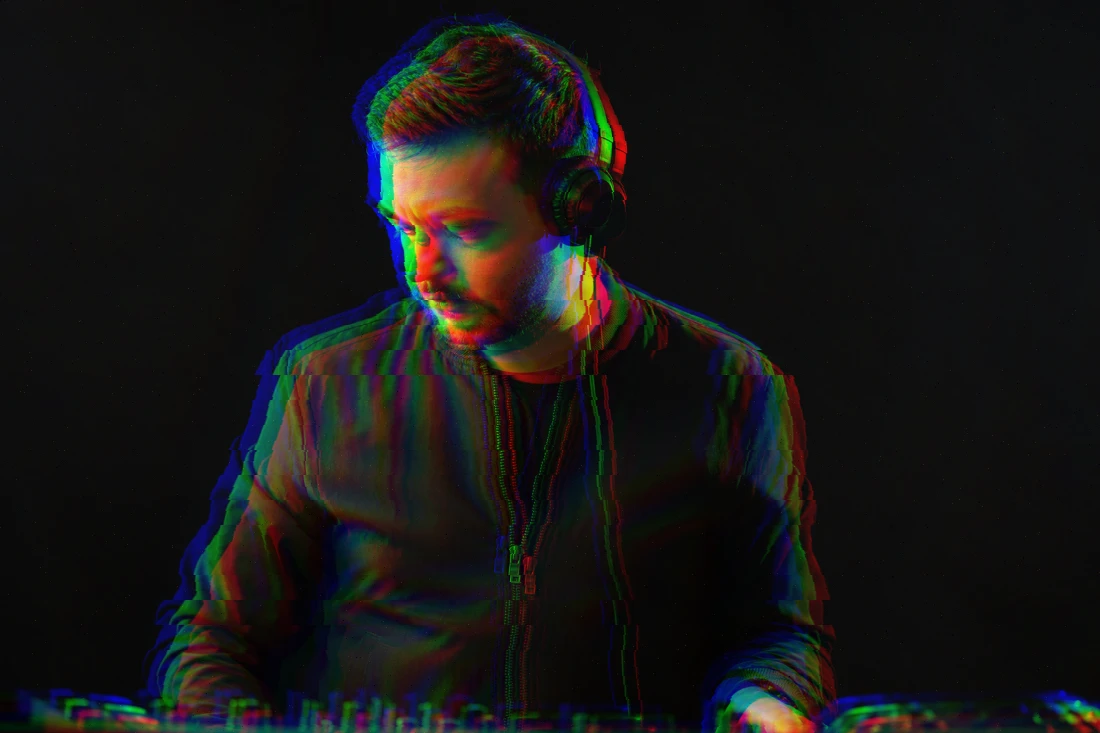 DJ portrait with horizontal RGB shift and random full-image tearing in Evoto