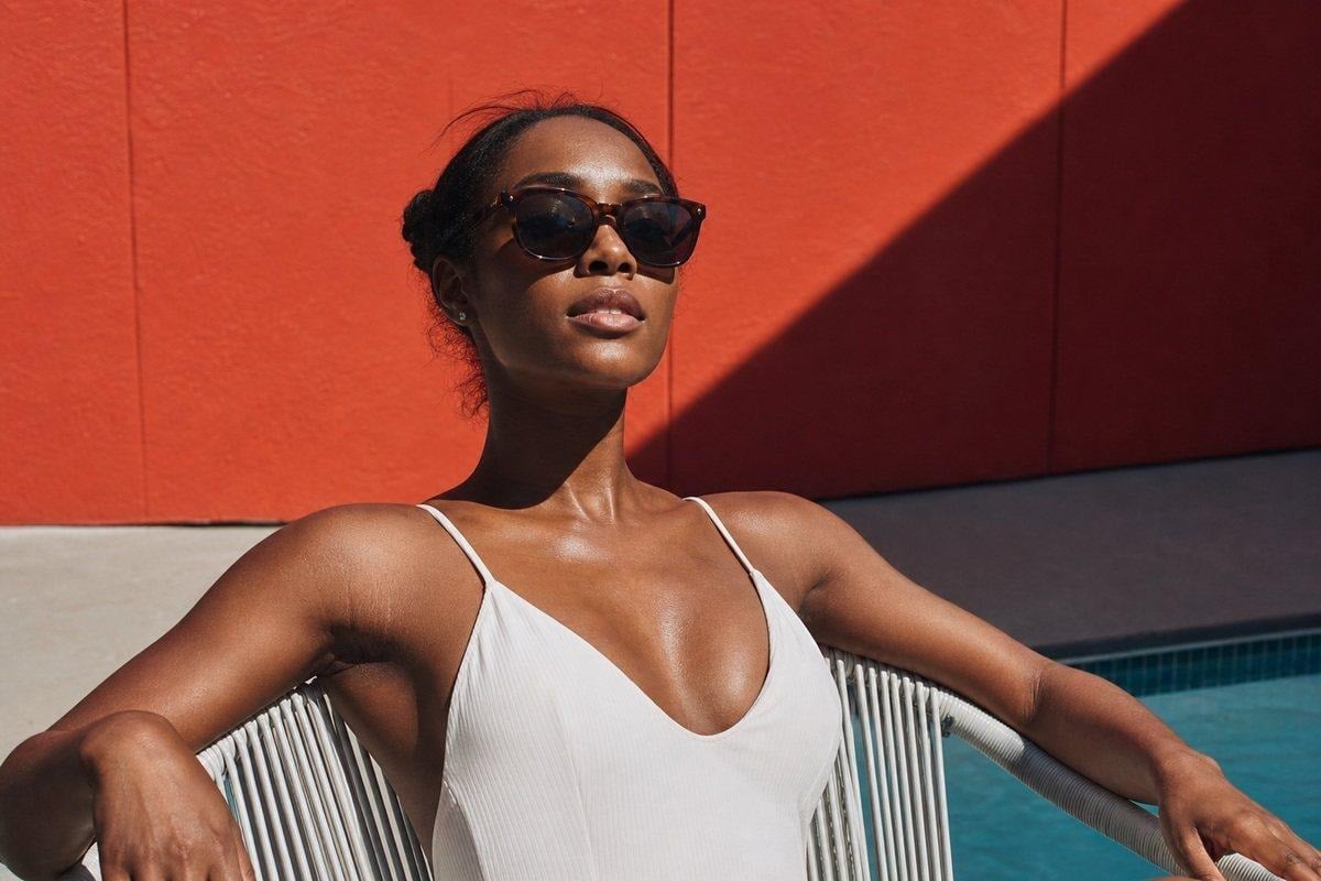 image 3 Summer portrait using harsh midday sun for a graphic editorial frame with controlled shadows and skin exposure