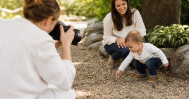 Photographer capturing a toddler during a relaxed natural light family session
